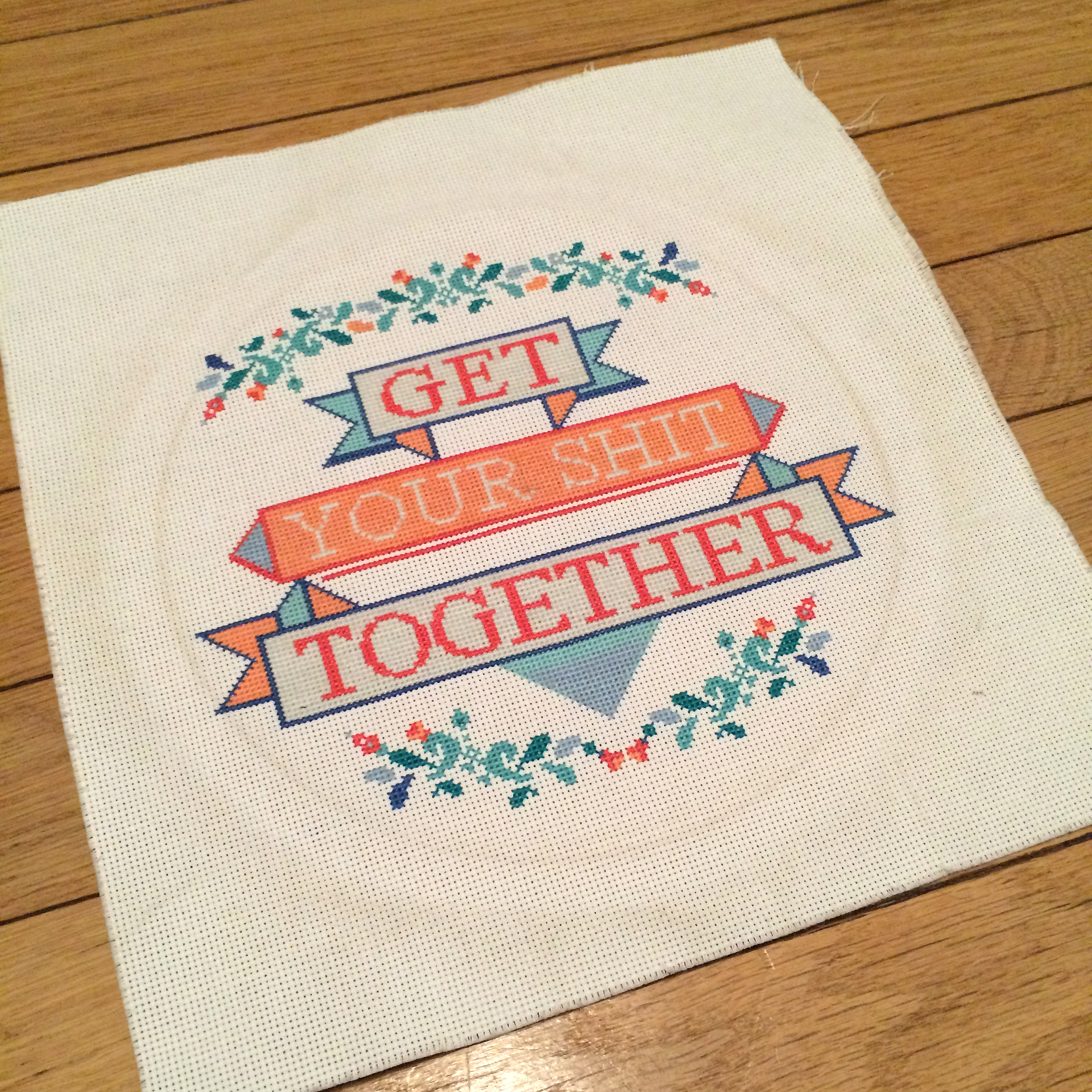 Cross-stitch project that says Get Your Shit Together